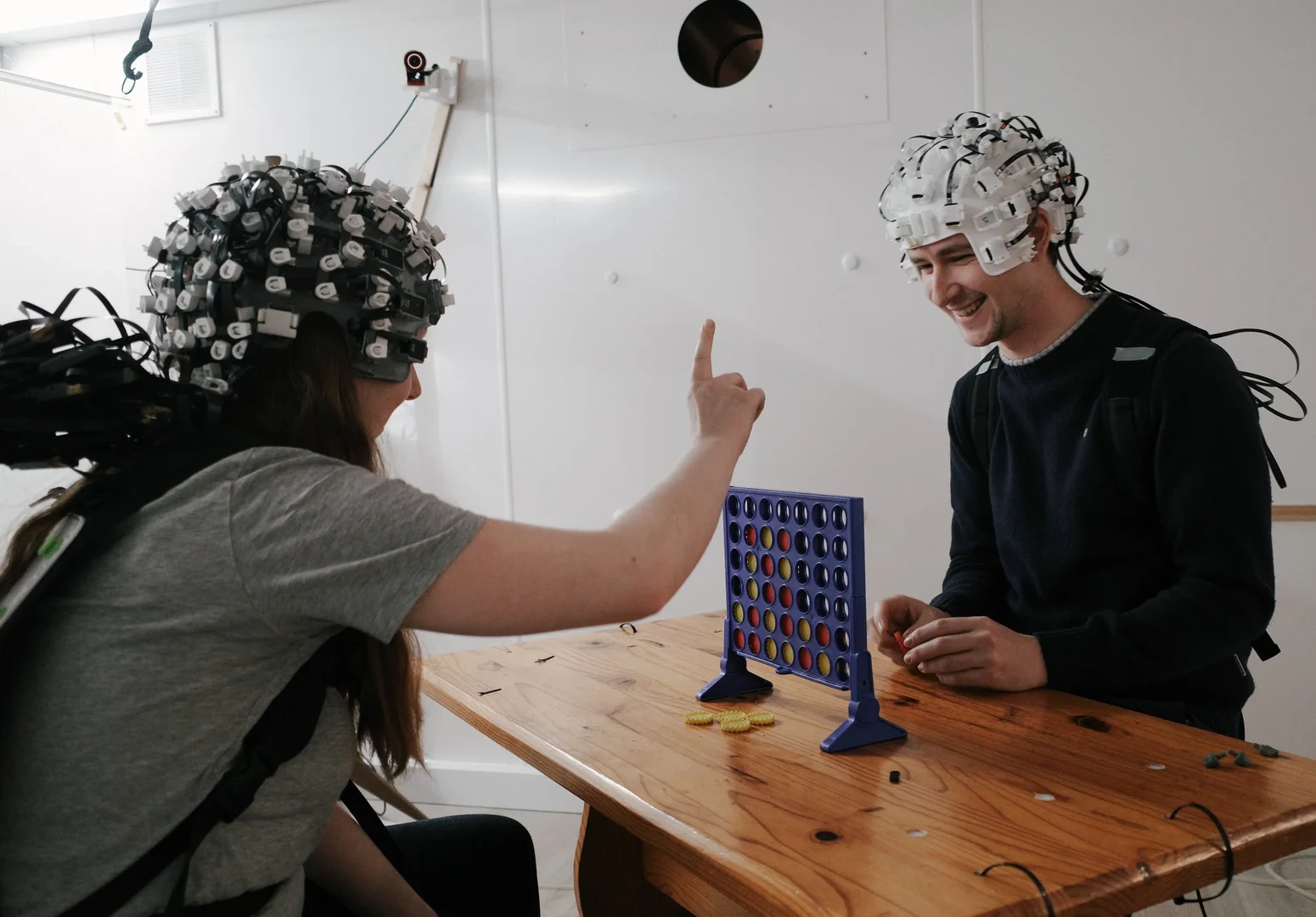 The photo shows two test subjects in a study at the Wellcome Centre for Human Neuroimaging am University College London (UCL) during an OPMEG scan.